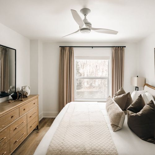 Bedroom 1 has a king bed and ceiling fan