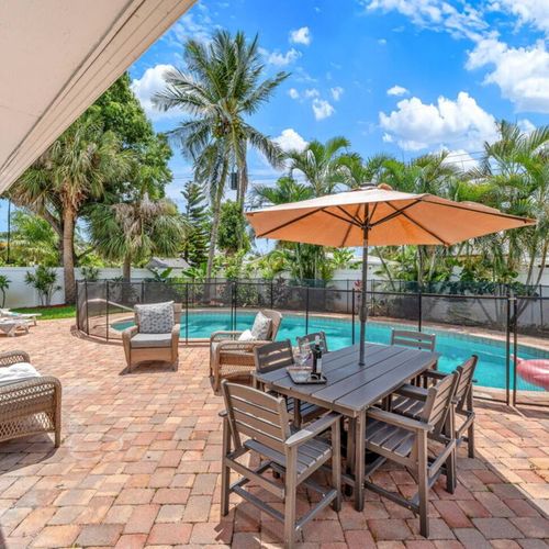 Seating around pool and backyard