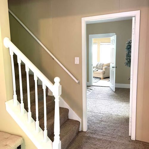 Stairs to upstairs located just off the side entrance/mudroom