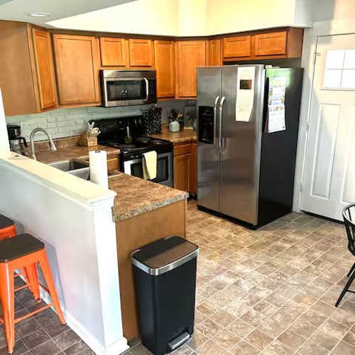 Your next home cooked meal awaits! The kitchen sits just near the backdoor to the backyard!