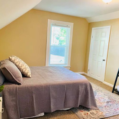 View of the 2nd bedroom, complete with cozy linens and ample storage!