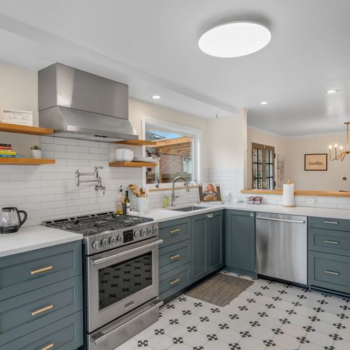 Fully equipped kitchen with modern appliances and ample prep space.