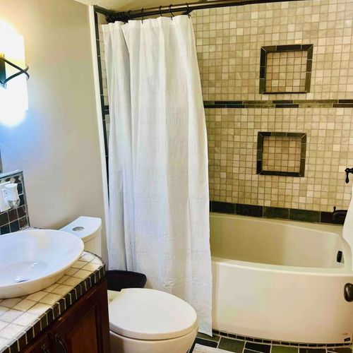 Full bathroom upstairs. Completed with a vanity, a shower tub combo, and essentials