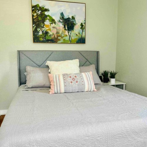 1st bedroom with a queen bed, linens, and ample storage!