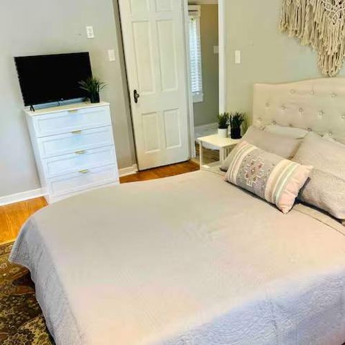 A view of the 2nd bedroom, complete with cozy linens and a TV!