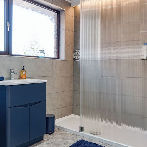 Clean, modern bathroom with essentials provided for a stress-free stay.