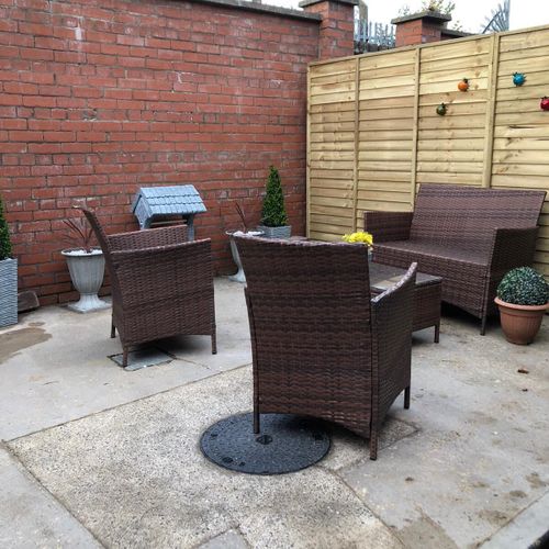 Cozy outdoor seating, perfect for morning coffee or evening drinks.