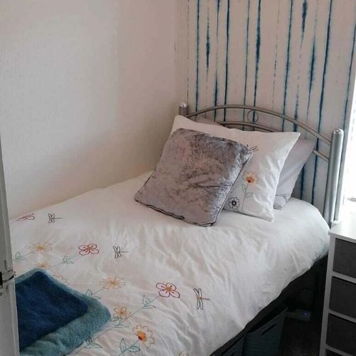 Cheerful bedroom with a twin bed, perfect for kids or an extra guest, with cozy touches to make it feel like home.