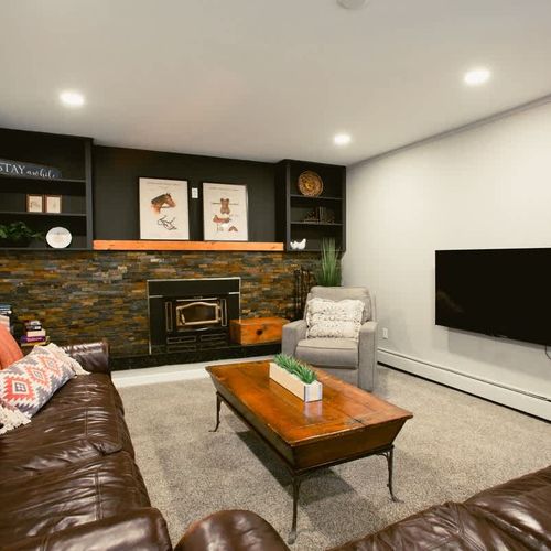 Living room with TV *Please note the fireplace is non-operational*