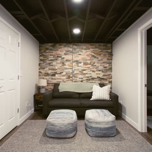 Basement living area with queen sleeper sofa