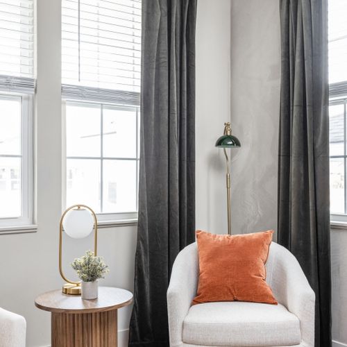 Earthy tones, layered textures, and clean lines create a grounded, modern retreat