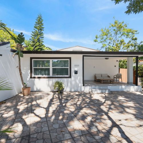 Lush entrance with space to accommodate 2 cars. First come, first serve parking.