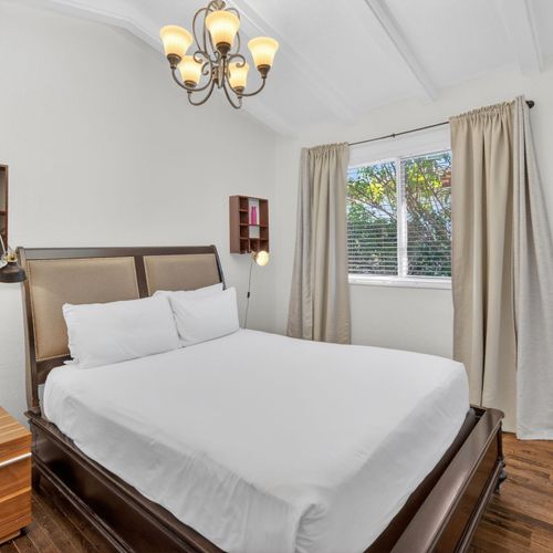 The second bedroom boasts a cozy queen bed and a TV for your entertainment needs.