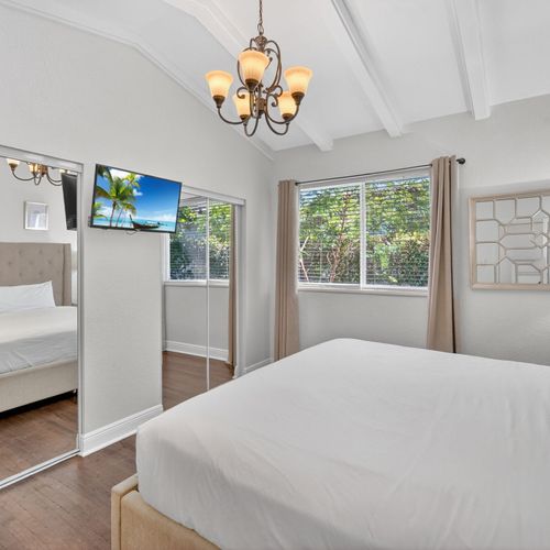 Unwind and sleep soundly in this chic and spacious master bedroom.