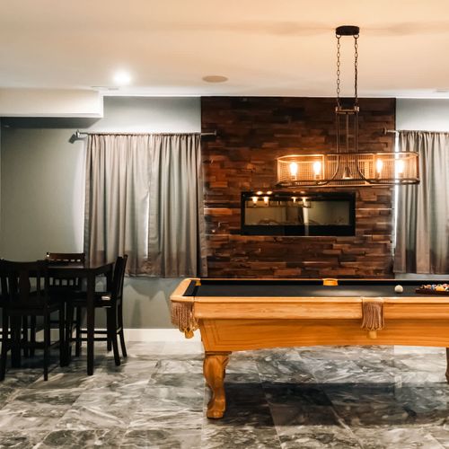 Basement game area with pool table and electric fireplace *Please note: Supplies for the popcorn machine are not provided*