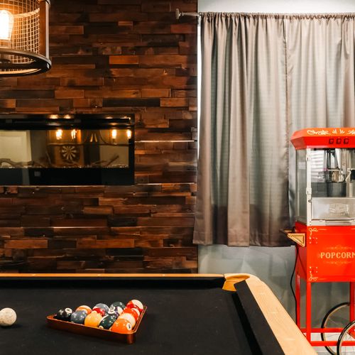 Pool table in basement *Please note: Supplies for the popcorn machine are not provided*
