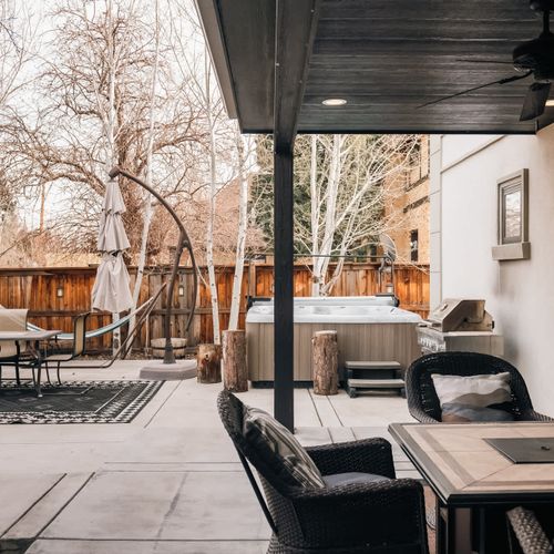 Back patio *Please note: The umbrella is not available for guest use. Propane levels are not guaranteed in the grill and fire pit. You may use them, but you are responsible for any propane needed.*