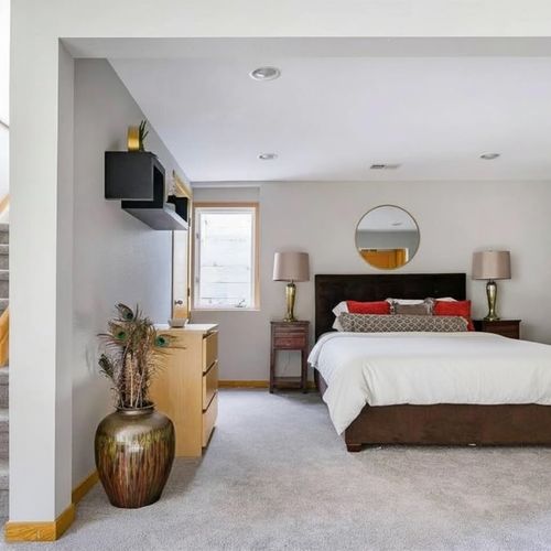 Large basement bedroom with queen bed