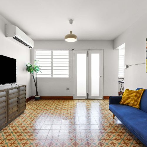 TV stand and blue sofa