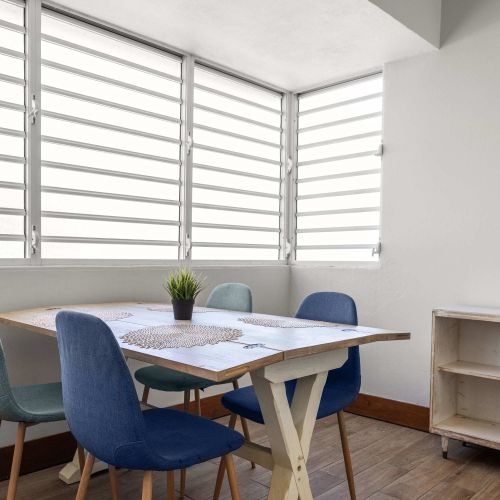 Sunny dining area with chairs