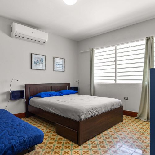 Bedroom with large blue bed