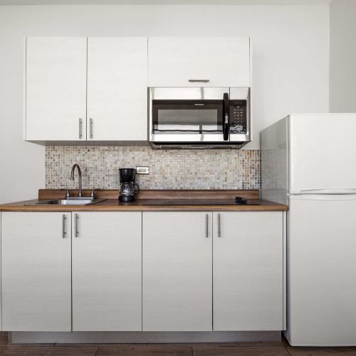 Pristine white kitchen, fully equipped