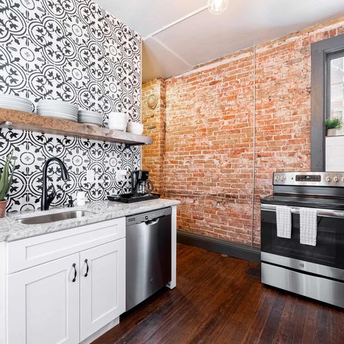 Kitchen with exposed brick on 1st floor