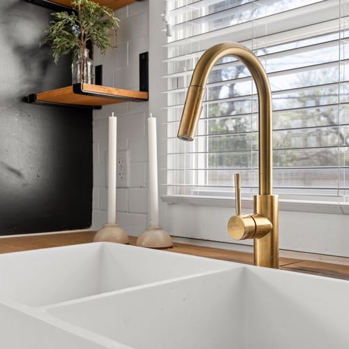 Thoughtful touches throughout, including a farmhouse sink and beautiful modern finishes.