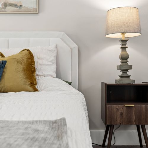 Cozy details that make it feel like a boutique stay, comfy bed, soft lighting, and all the vibes.