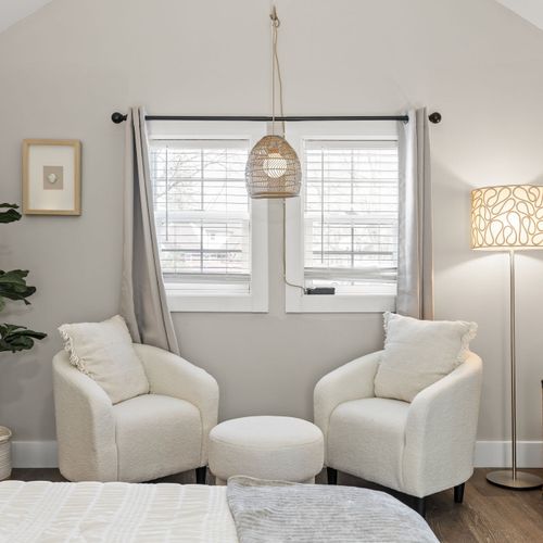 Primary suite goals, dreamy lighting, cozy seating nook, and all the space to truly unwind.