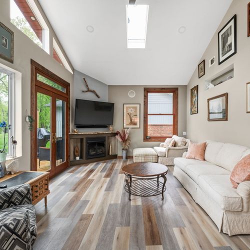 Such a peaceful room. This is the wonderful sunroom. A perfect place to relax and watch the dogs or kids play, all from the comfort of A/C and no mosquitoes, does it get better than that?