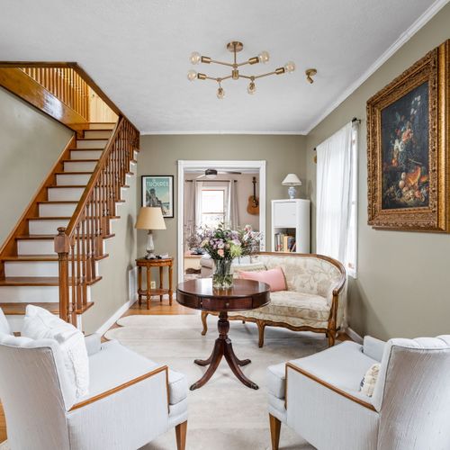 Step into a beautifully curated living space blending vintage character with modern touches.