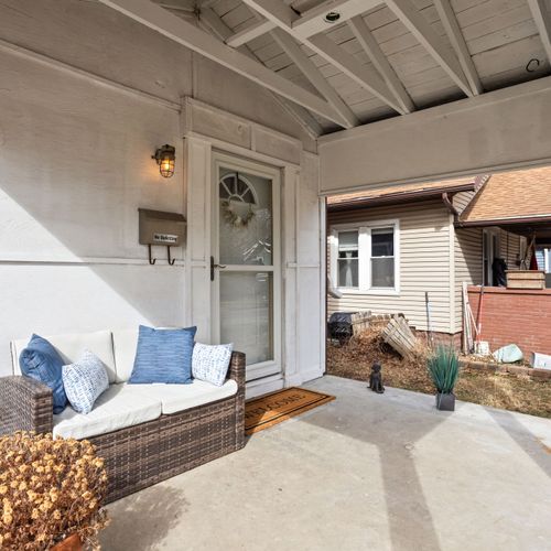 Relax on the cozy covered front porch — perfect for morning coffee or watching the world go by.