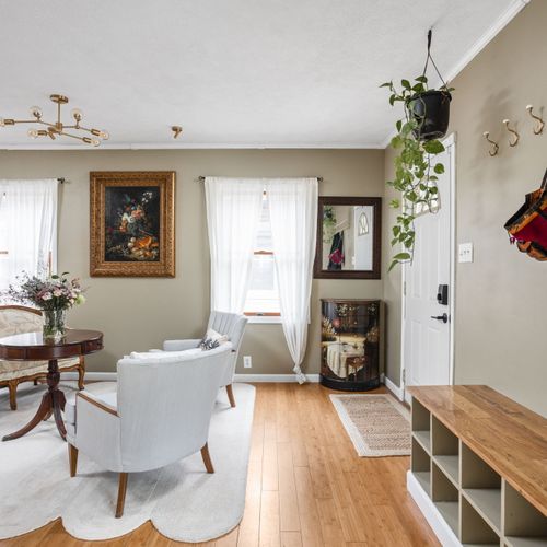 Bright, open living room flowing seamlessly into the rest of the home for easy gathering.
