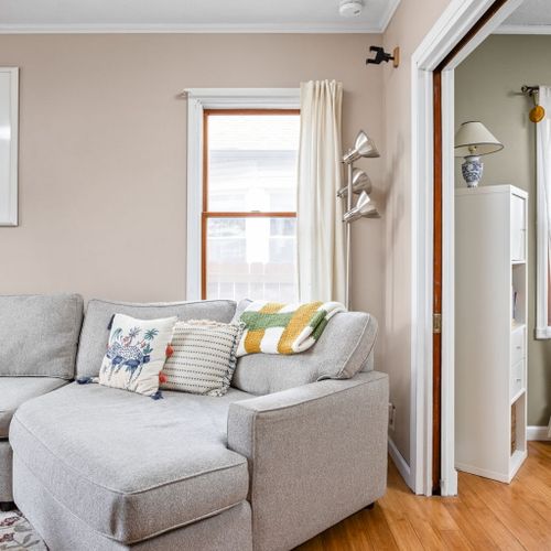 Sink into the plush sectional and enjoy this bright, inviting den filled with character.