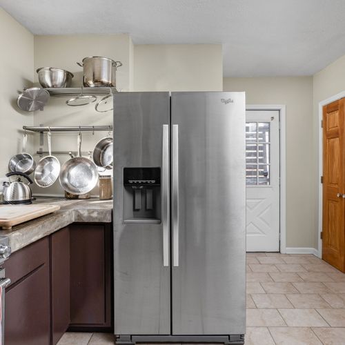 Plenty of storage and counter space with stainless steel appliances and a convenient back door to the yard.