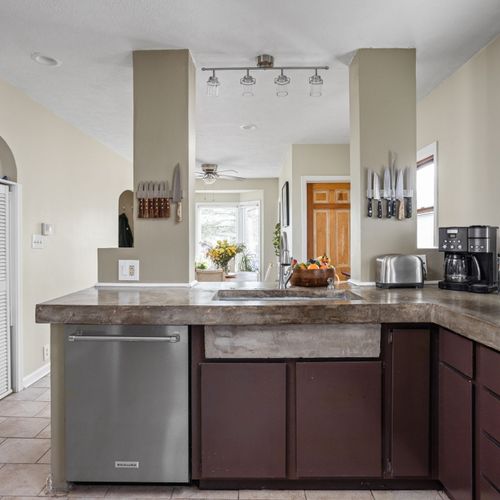 Open kitchen layout with breakfast bar — perfect for cooking, entertaining, and gathering.