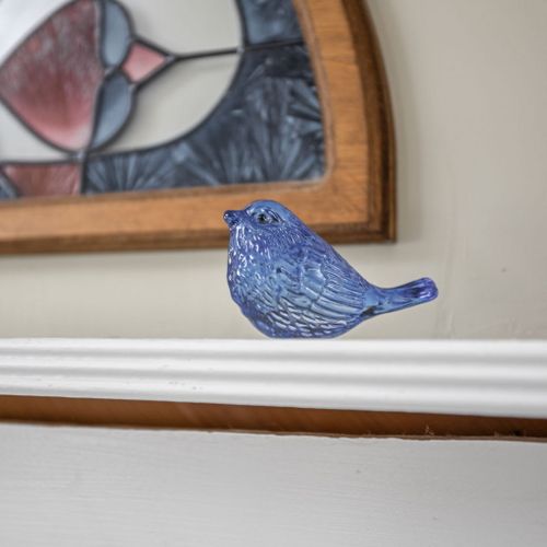 Charming vintage details and stained glass accents add character throughout the home.