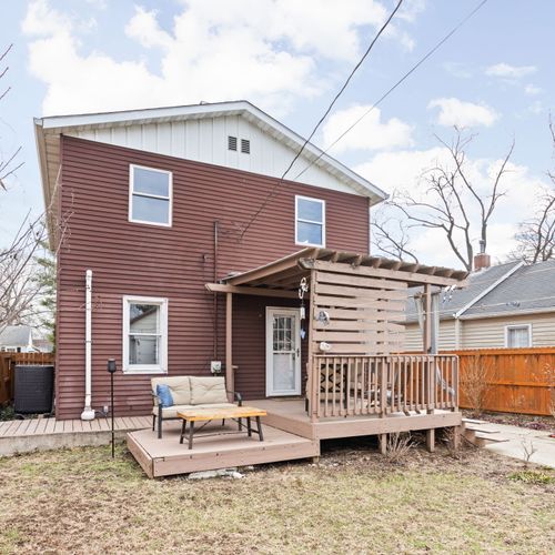 Relax in the shade of the covered deck and take in views of the private, fenced backyard.