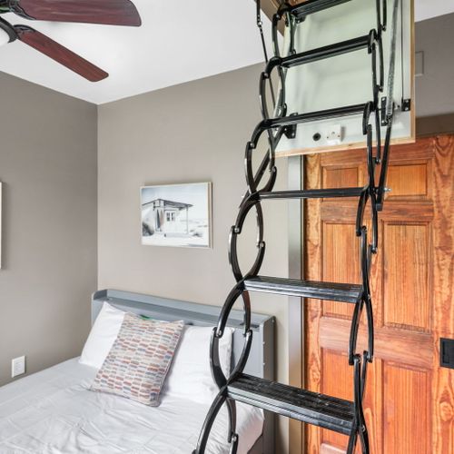 Climb the ladder and enter a world of your own! This secret hideaway is accessed through a hidden drop-down staircase — adventure awaits above.