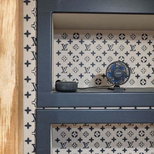 Every detail was thoughtfully curated, from the bold designer-inspired wallpaper to the custom-built display nooks — even a personal fan and smart speaker for your comfort.