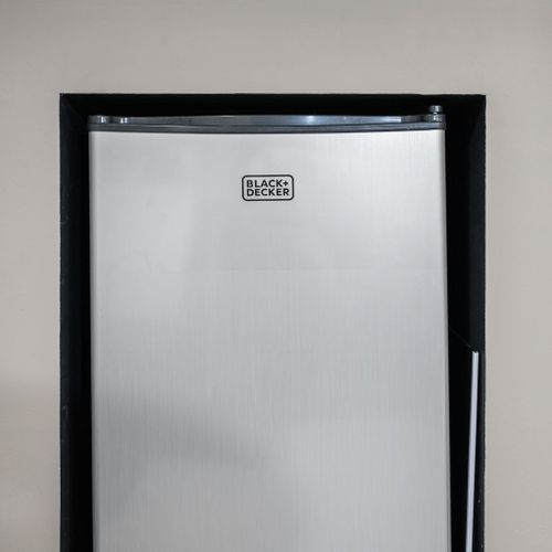 A built-in mini fridge keeps drinks and snacks chilled and within arm's reach — no need to leave your private retreat.