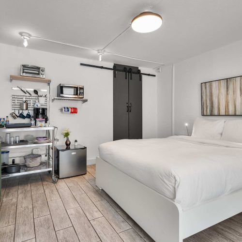 Rest easy with dedicated bedside reading lights and built-in shelving. Every detail is curated to offer a peaceful, clutter-free retreat.