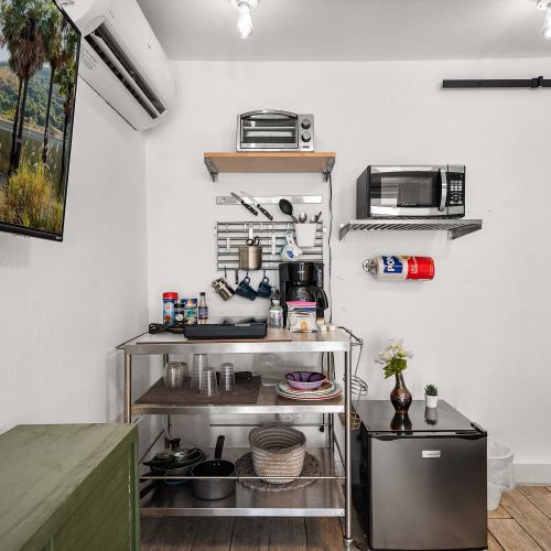 Prep quick meals or your morning brew in the stainless-steel kitchenette, equipped with a microwave, toaster oven, coffee maker, and mini-fridge.
