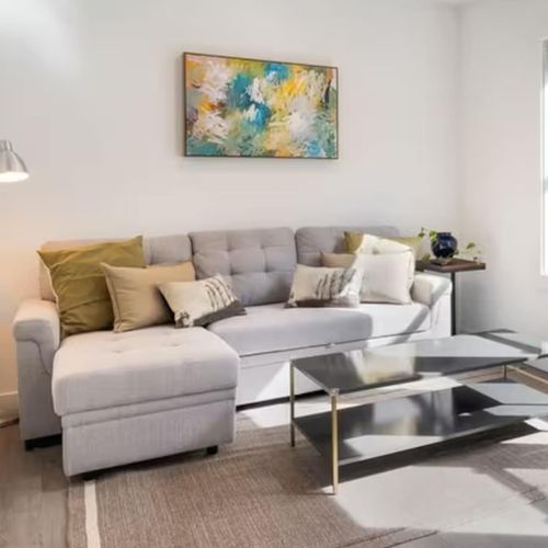 Watch a show or take a nap in this bright space with large windows and comfortable seating.