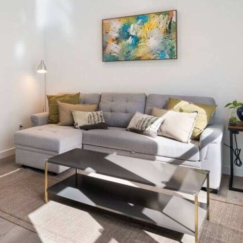 Stretch out on the sectional or read by the window. Open layout connects easily to kitchen and dining.
