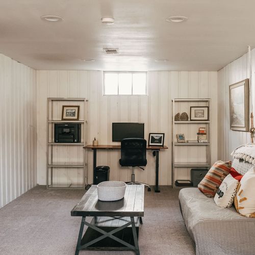 Basement living area with workspace