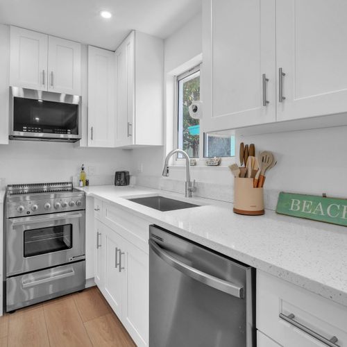 Enjoy a clean, modern kitchen featuring ample counter space, updated appliances, and a fresh, inviting ambiance.