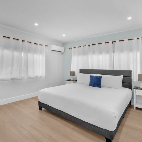 Generously sized bathroom featuring a walk in shower, updated fixtures, and a simple, functional layout.