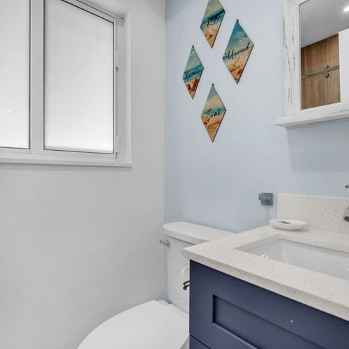 Bright and clean bathroom with a sleek vanity and stocked with all the essentials you’ll need during your stay.